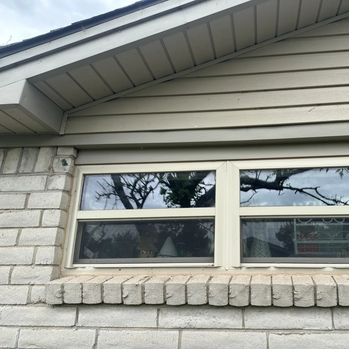 Beige Siding Exterior With Installed Replacement Windows in Oklahoma