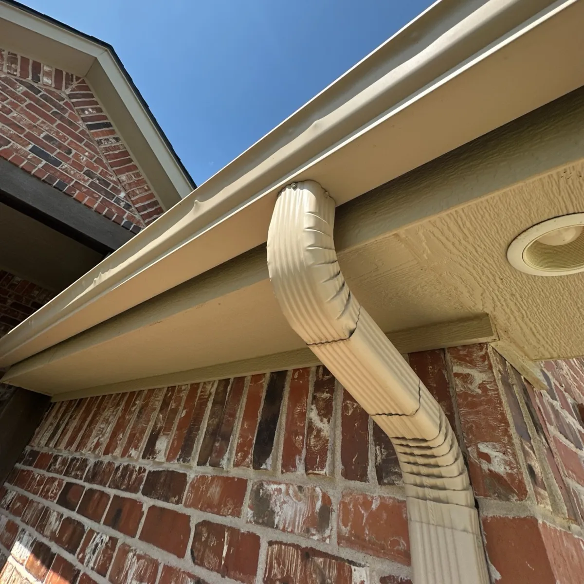 Oklahoma Downspout And Gutter Installation Under Roof Eave