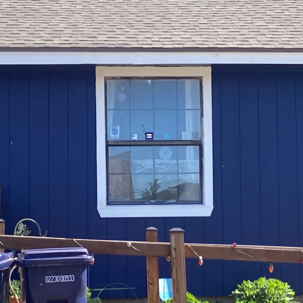 Blue Siding Home With New Replacement Window in Oklahoma