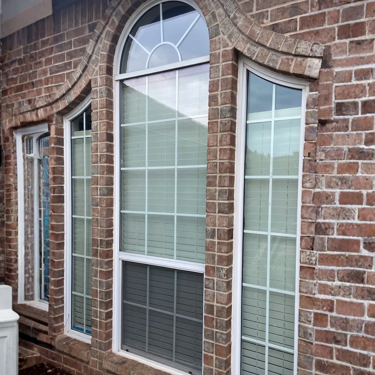 Brick Home Window Replacement With Arched Windows in Oklahoma