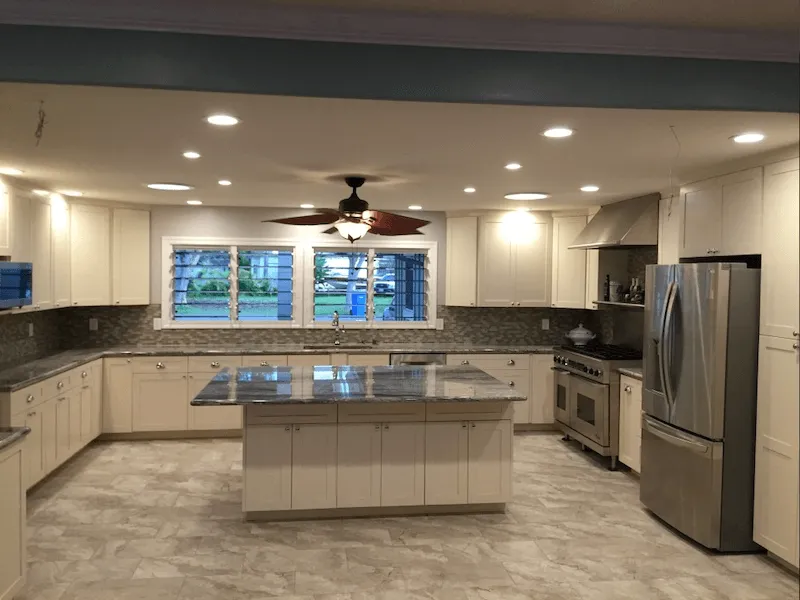 a kitchen with white cabinets