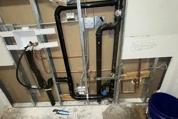 A newly constructed commercial office space in Honolulu, with glass walls, local artwork, and a collaborative workspace layout, filled with natural light and a view of the city skyline.