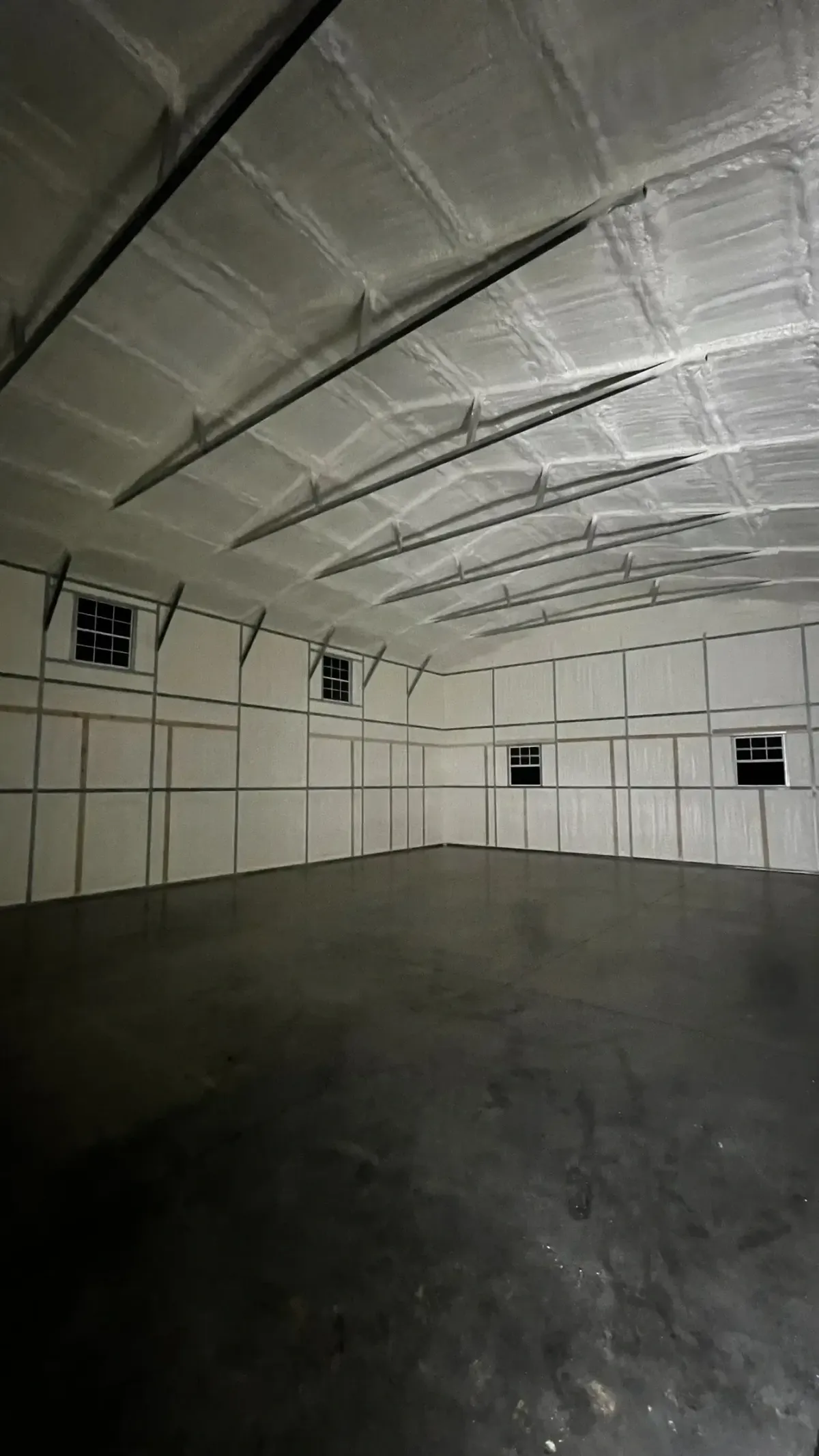 Closed cell spray foam insulation in large metal building for superior strength and energy savings