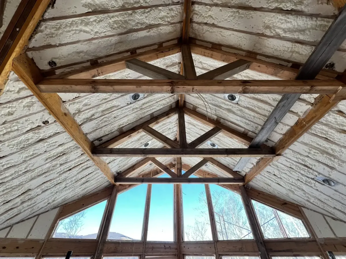Foam insulation sprayed under roof decking in Cary attic