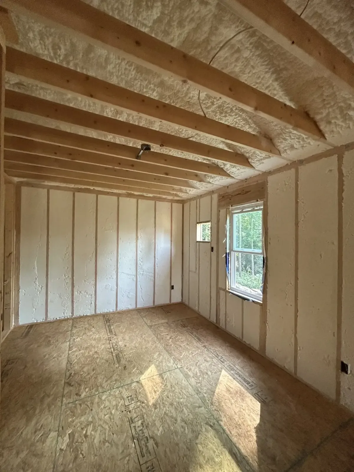 Team sealing gaps with blown-in insulation during audit in Raleigh