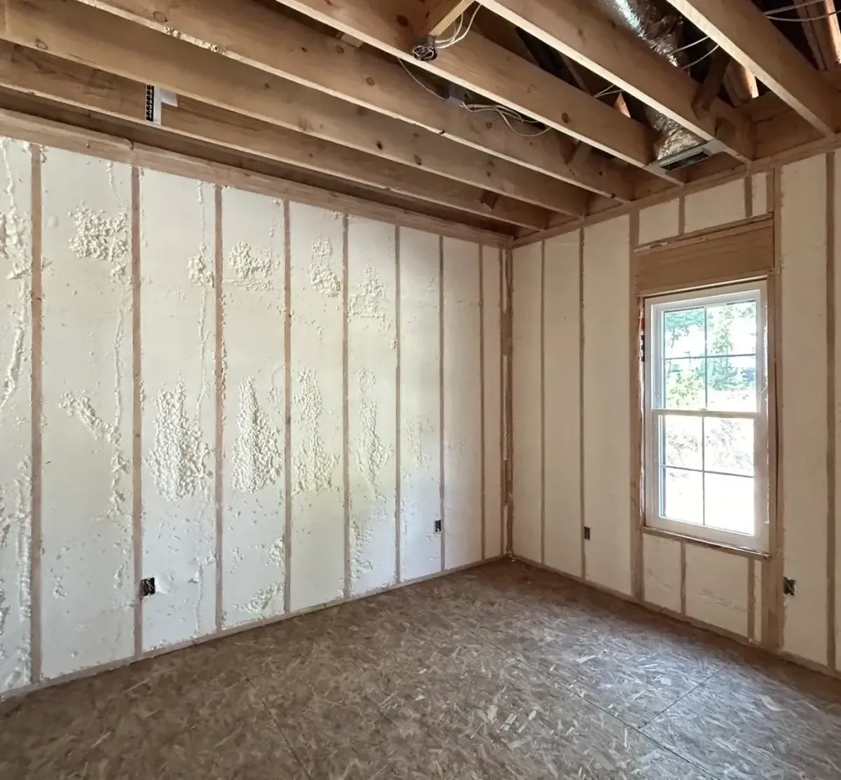 Contractor sealing air leaks with attic insulation in Morrisville