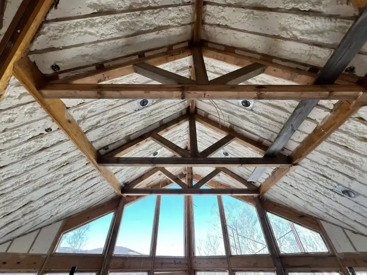 Closed-cell spray foam insulation applied to pole barn ceiling in Raleigh, NC by Energy Saving Insulation