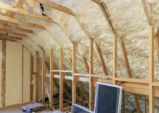 Attic in Raleigh insulated with open-cell spray foam for energy efficiency and moisture control