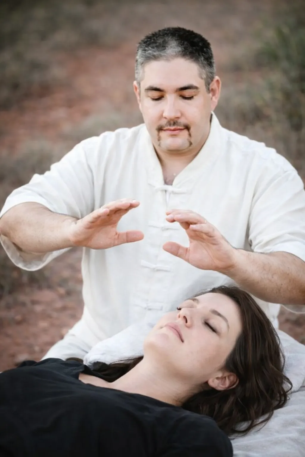 Professional energy healing session with Grandmaster David Harris using hands-on-healing methods.