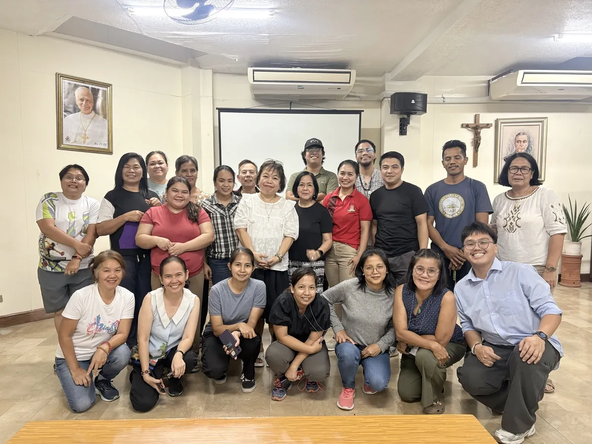 Community members and local volunteers collaborating in community-based disaster management planning