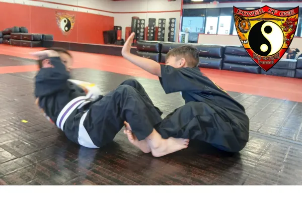 youth helping each other with motivational situps.  leadership skills