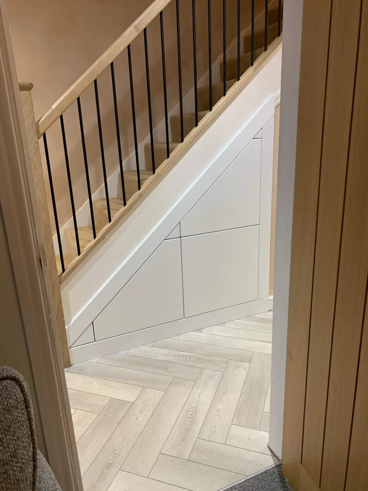 Minimalist white under-stair storage with push-to-open drawers - handleless design by JAX Bespoke