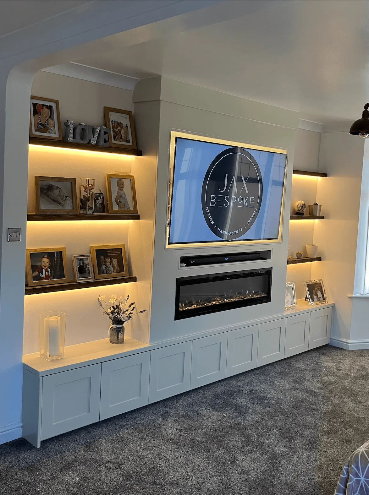 Sprayed furniture style media wall with storage cupboards and display shelving by JAX Bespoke Yorkshire