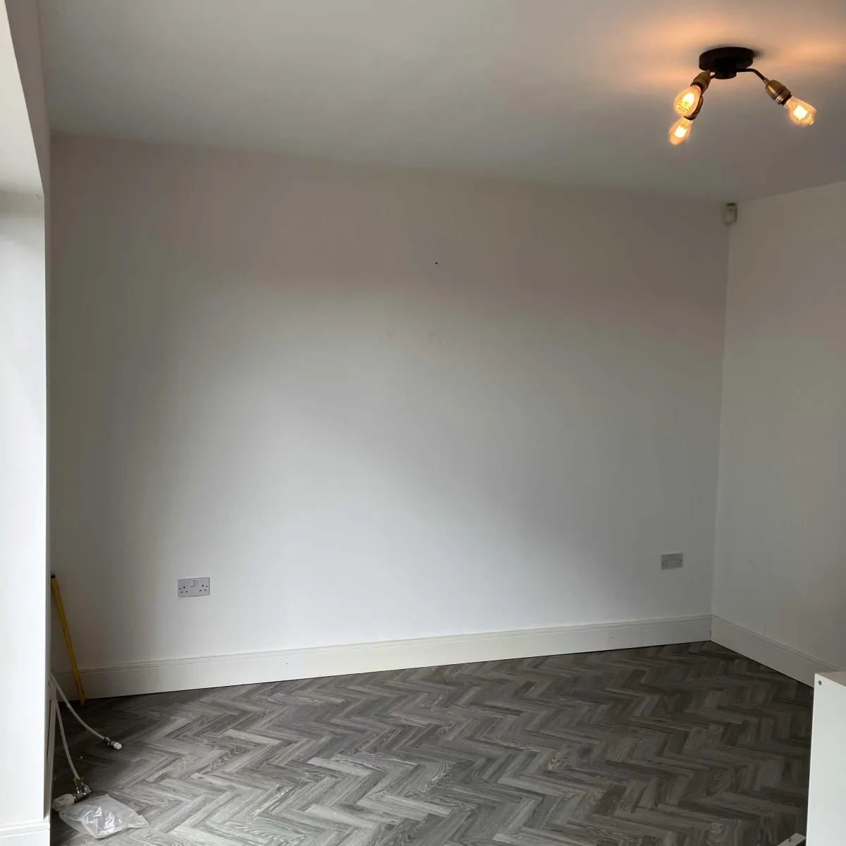Before photo: Empty wall space in a Yorkshire home, awaiting luxury bespoke media wall installation