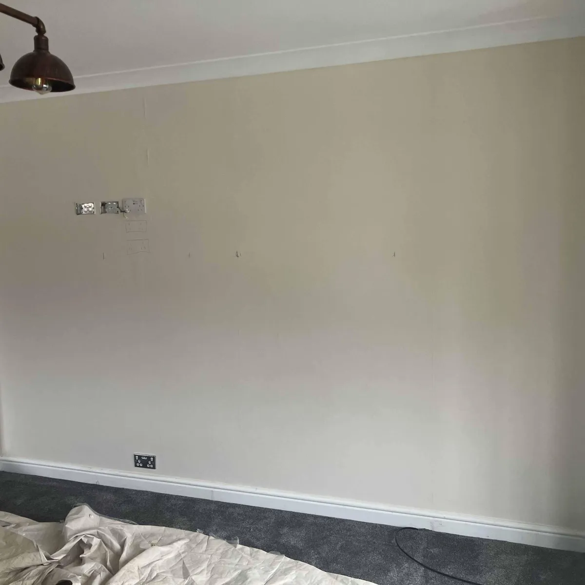 Before photo of blank wall in a new build Yorkshire home - ready for a media wall installation