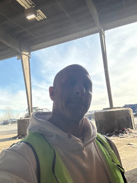 Cameron Nemitz self portriat while working on a junk removal job in Aurora, CO