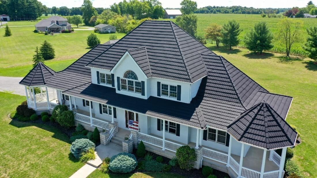 large white home with beautiful new roof