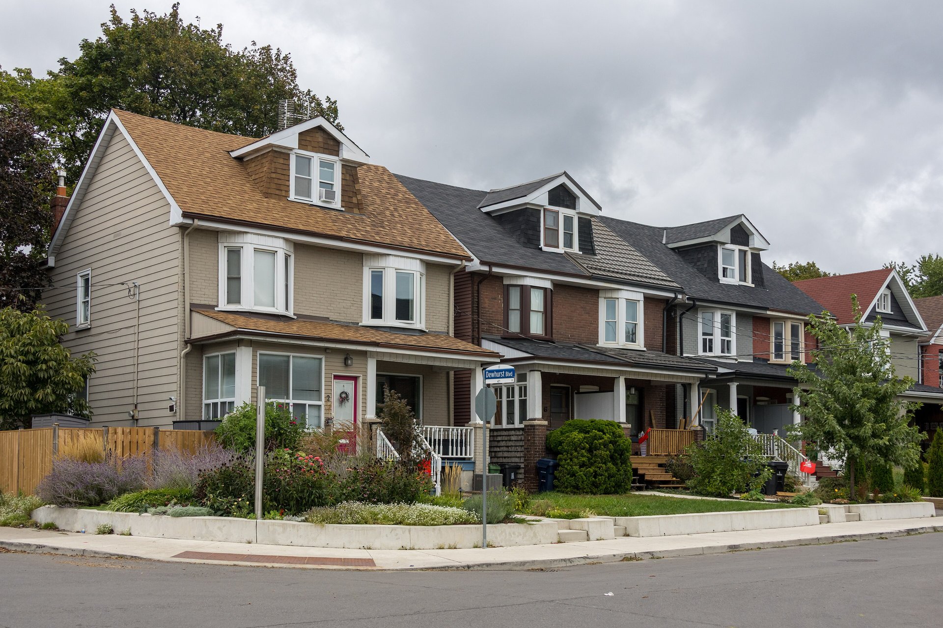 Brick and sided semi-detached houses on Strathmore Boulevard, East York, Toronto