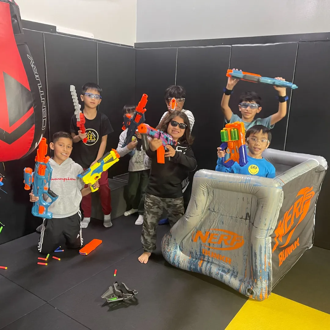 person pouring sand into boys hands
