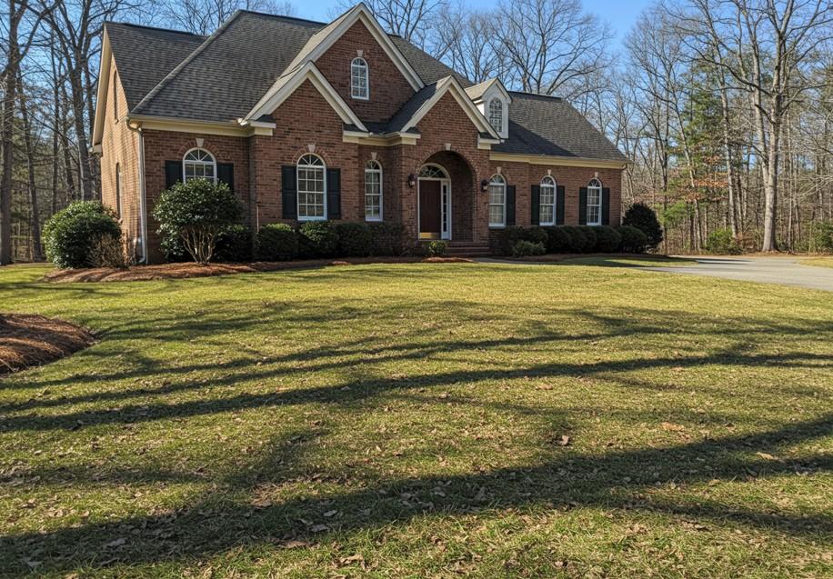 Front yard in Atlanta with clean lawn mowing lines and freshly cut grass