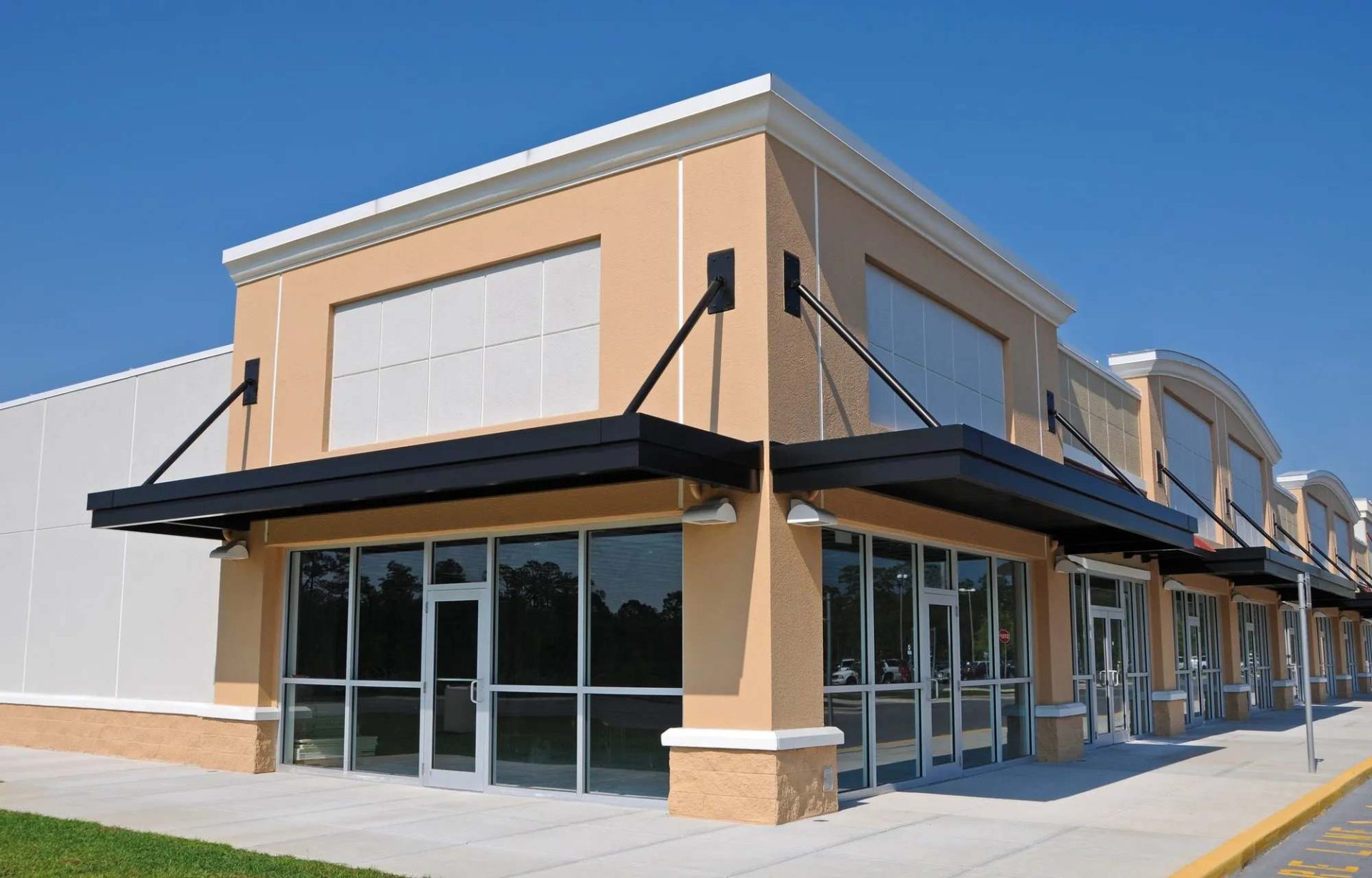 Commercial building exterior in Paducah, KY, featuring professional paintwork, modern design, large glass windows, and durable materials, highlighting Copeland Painting's commercial painting services.
