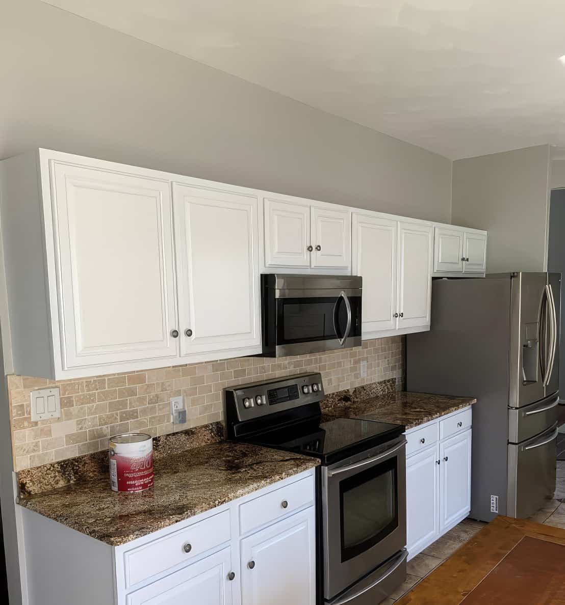 Benton KY cabinet painting — refreshed white cabinets with brushed nickel hardware