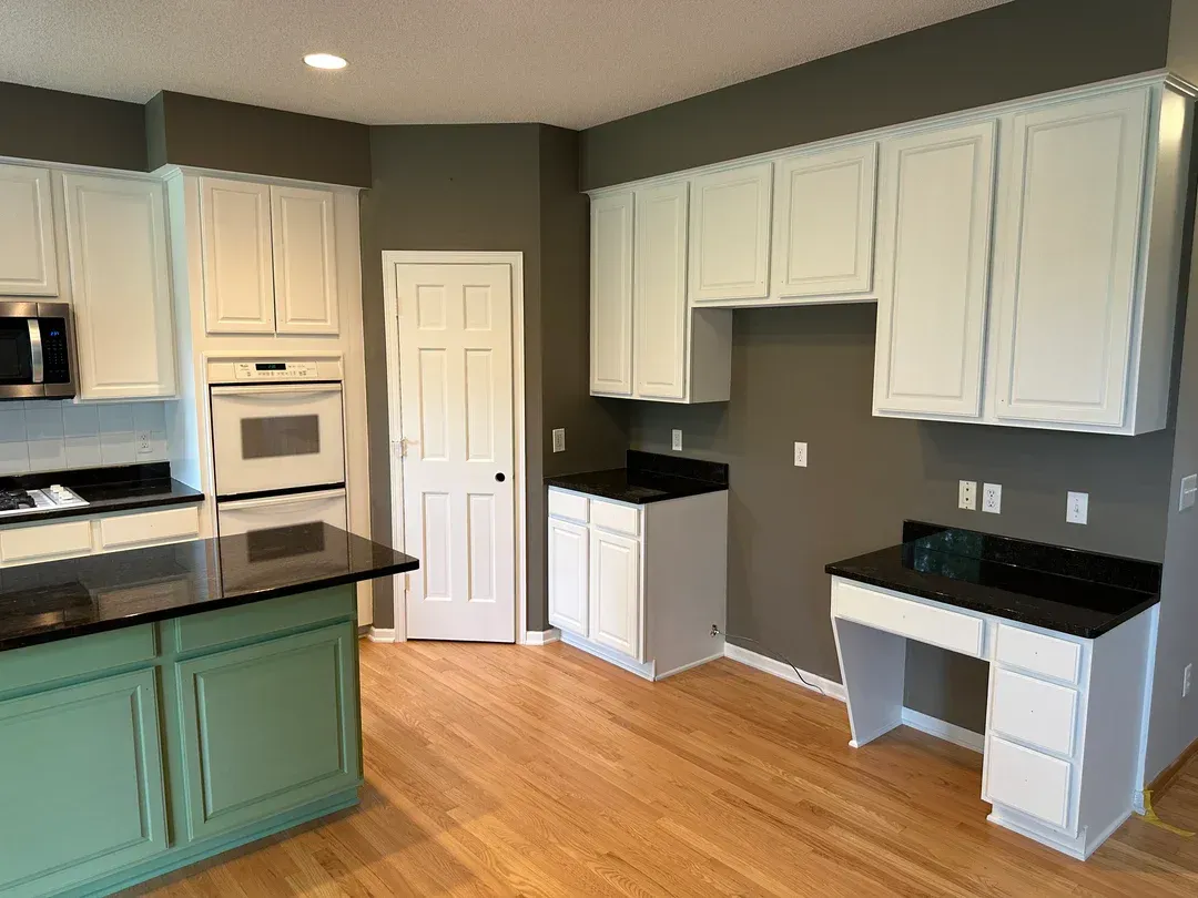 Benton KY cabinet painting — shaker-style cabinets mid-refinish