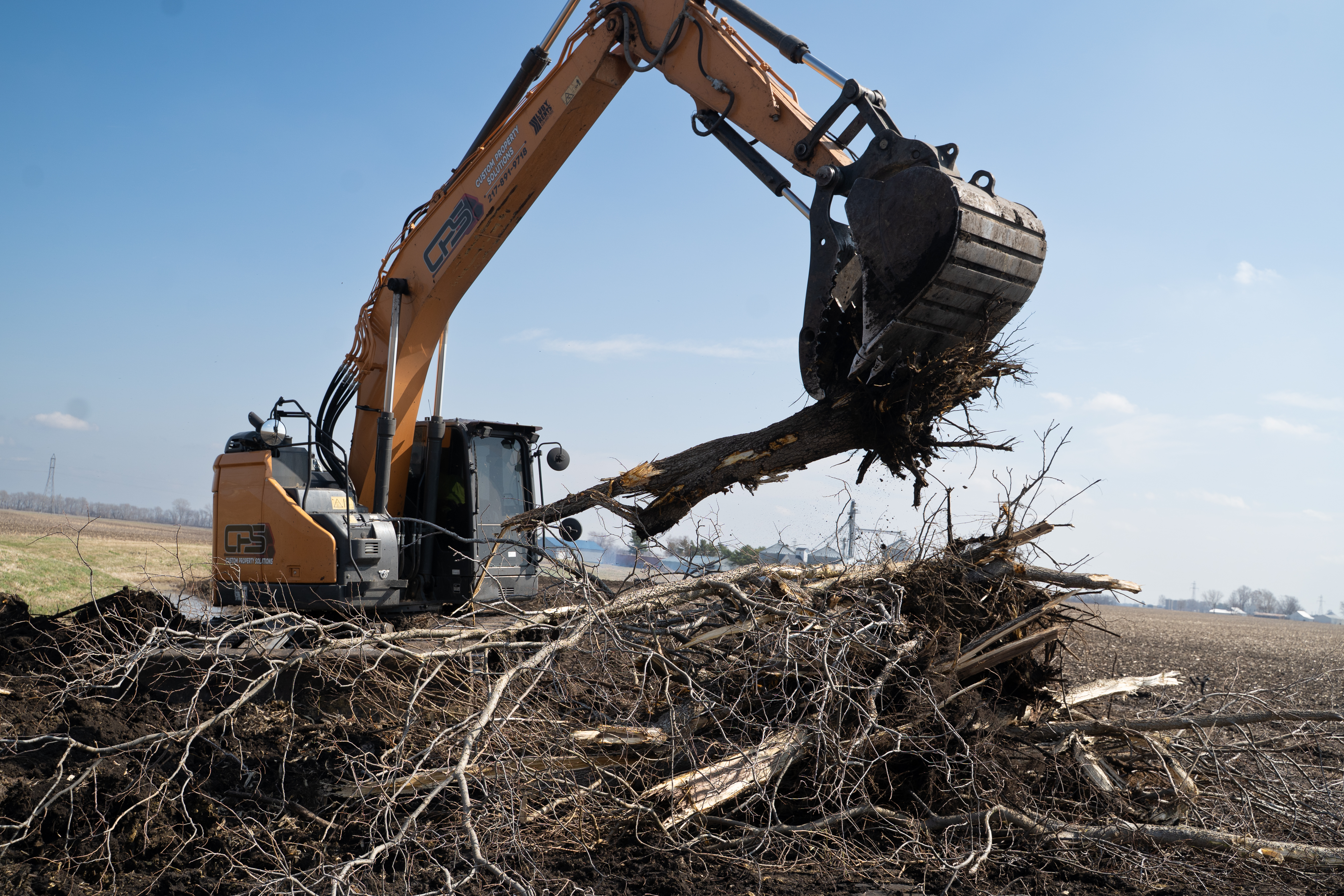 Land clearing project by Custom Property Solutions in Central Illinois
