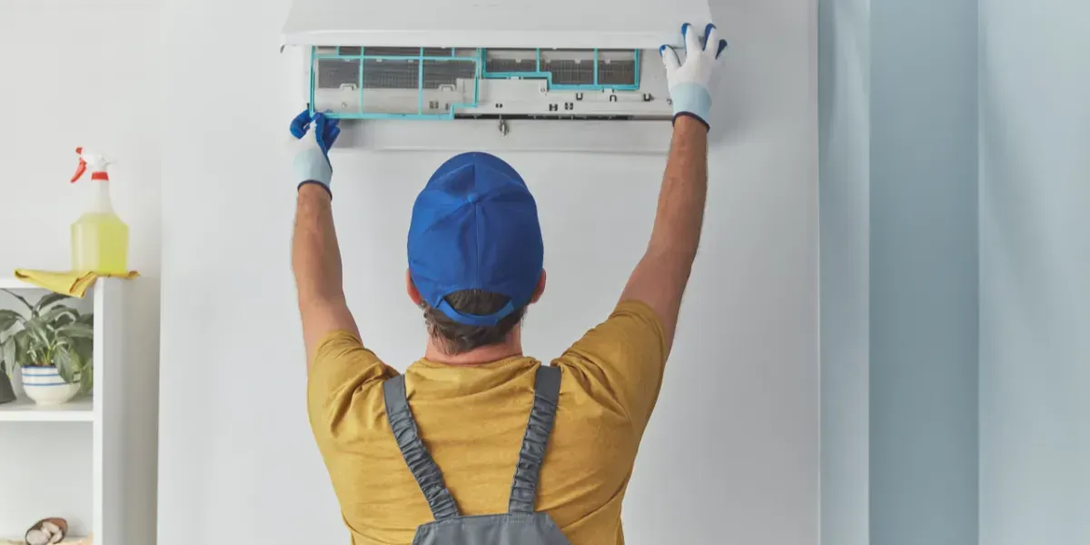 Worker Fixing AC