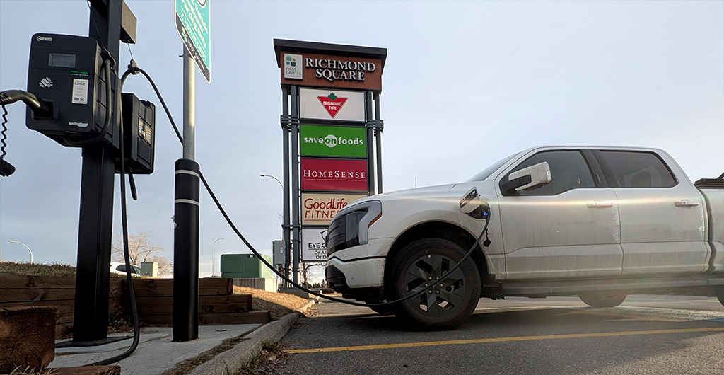 Sleek Ford electric truck connected to a commercial Prestige Electric EV charger