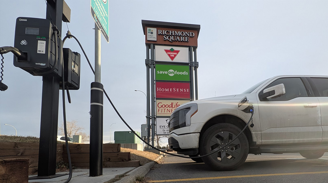 Sleek Ford electric truck connected to a commercial Prestige Electric EV charger