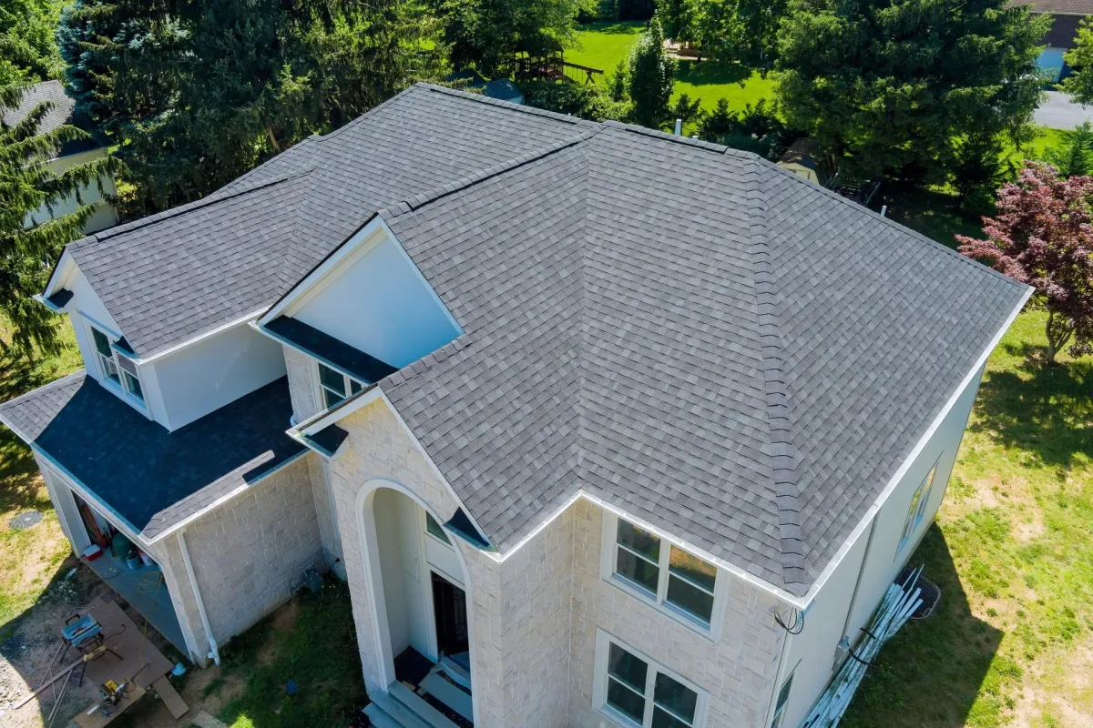 a beautiful newly installed shingle residential roofing