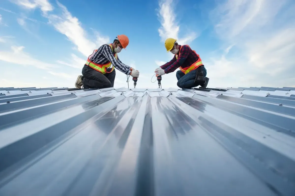 a group of expert roofers installing a commercial roof