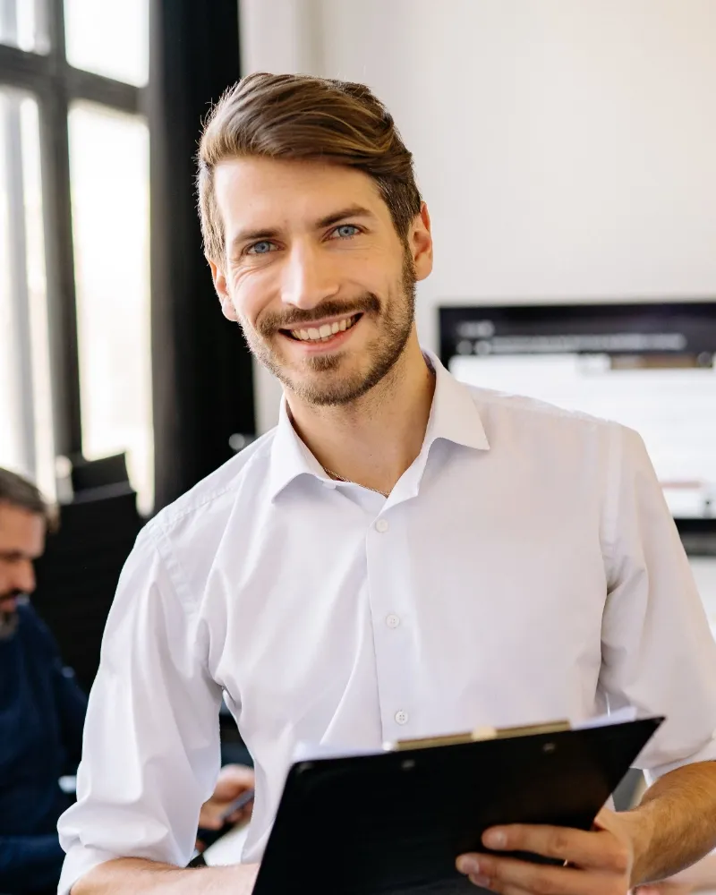 Happy salesperson with a coffee