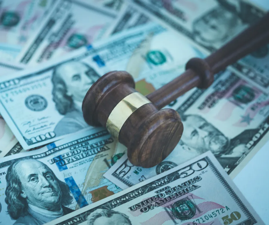 lawsuit money and judge's gavel