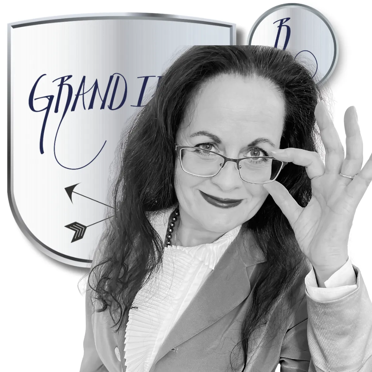 Céleste in front of her registered trademark looking over glasses.