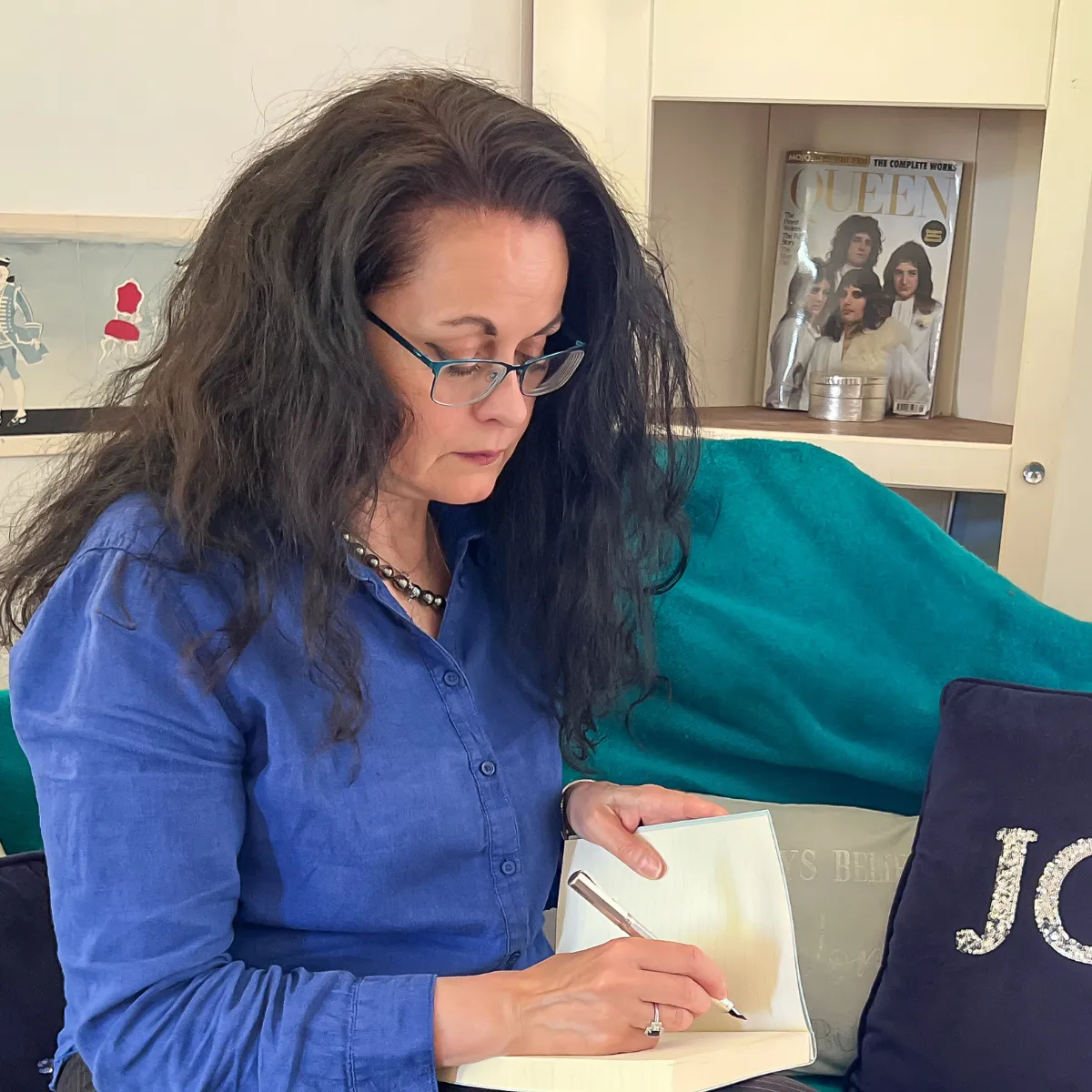 Céleste writing in her notebook