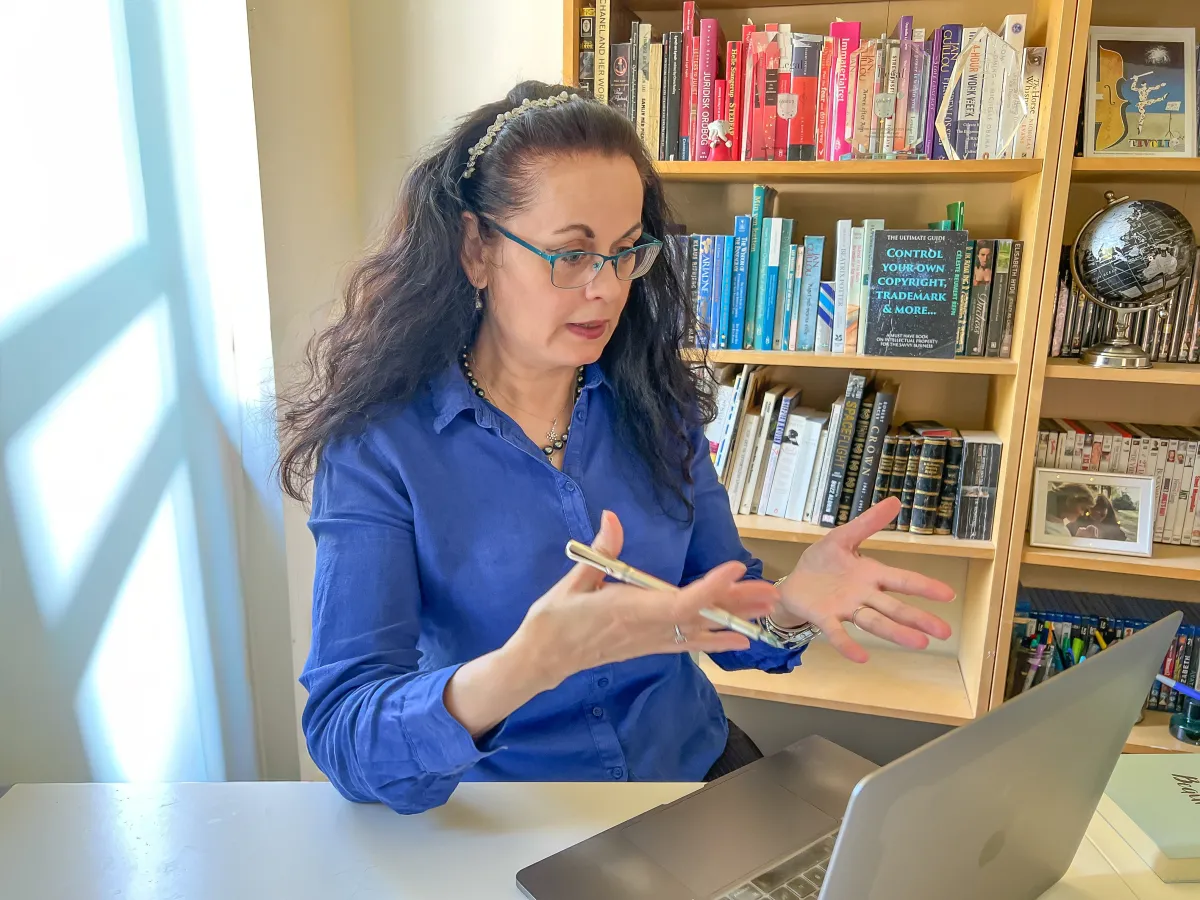 Céleste Talking animatedly to a client