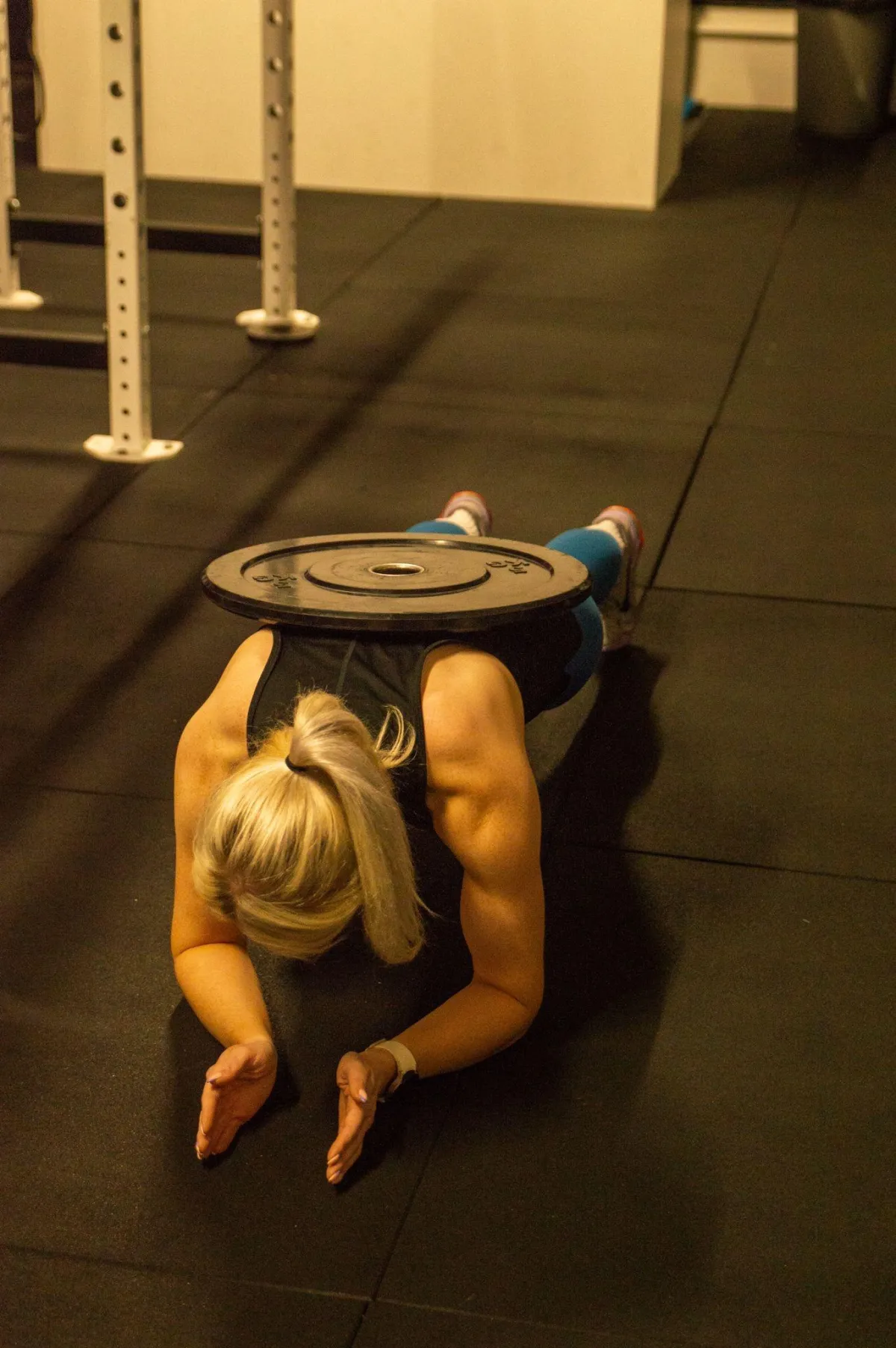 woman sitting on exercise bench