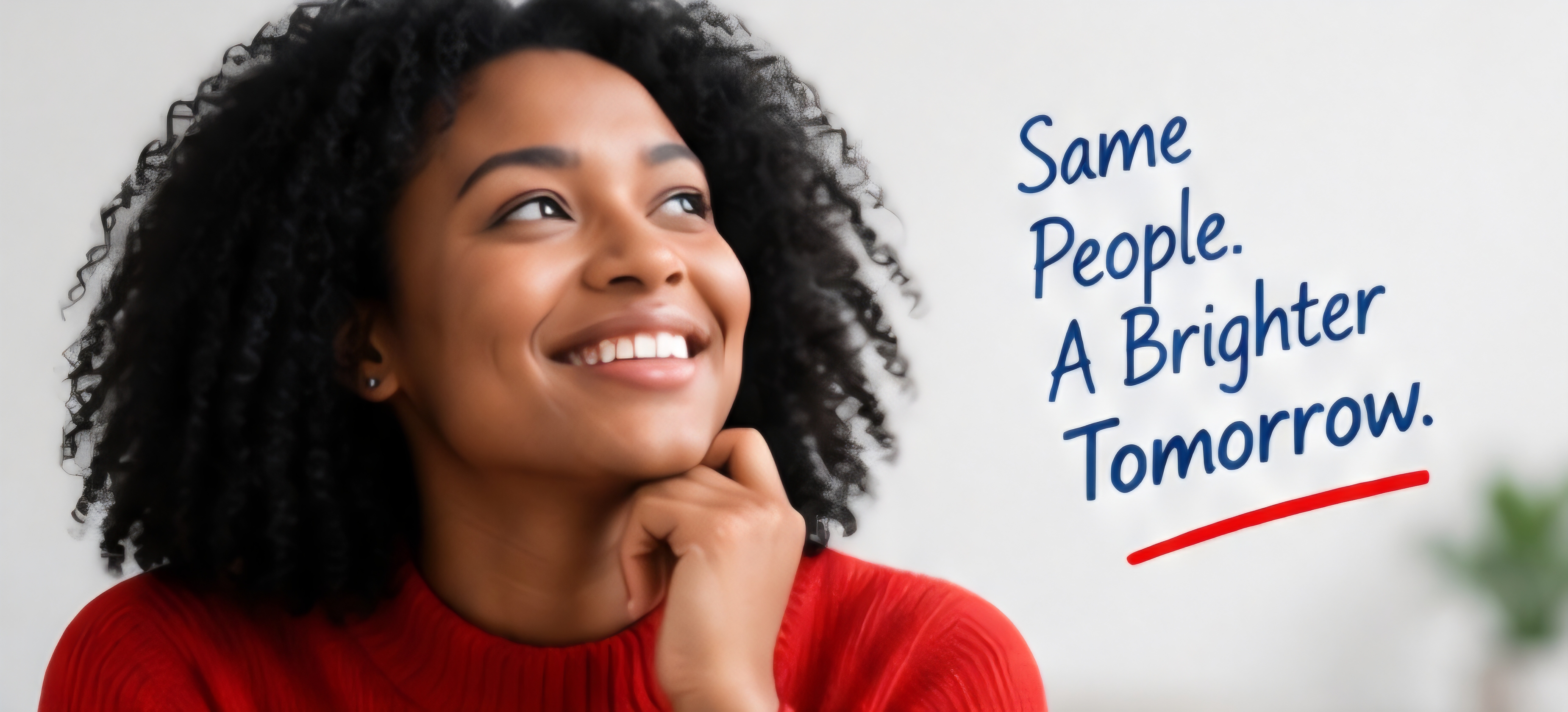 Smiling Black woman in a red sweater looking upwards, conveying hope and positivity.