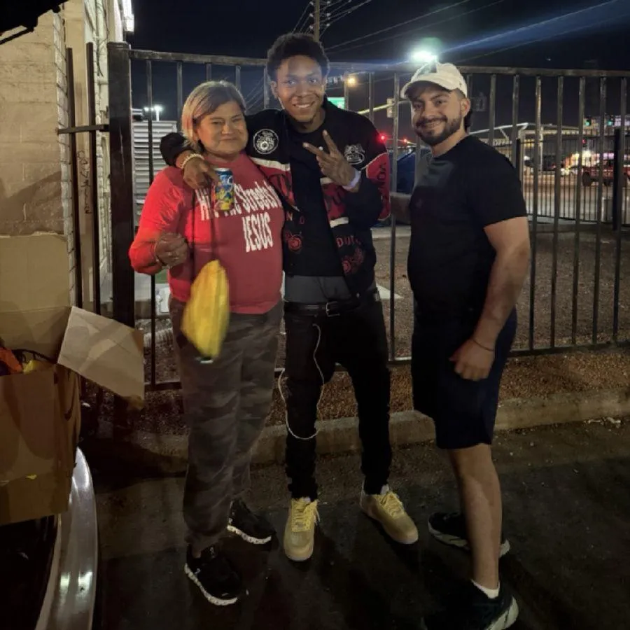 woman in white long sleeve shirt using black laptop computer