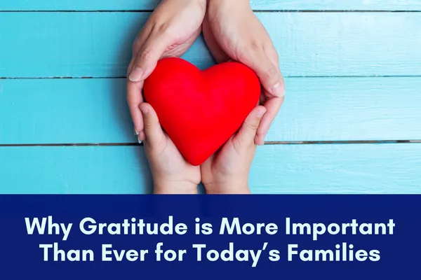 Child's hands placing a large red heart into adult hands with the title, Why Gratitude Matters More Than Ever for Today's Families