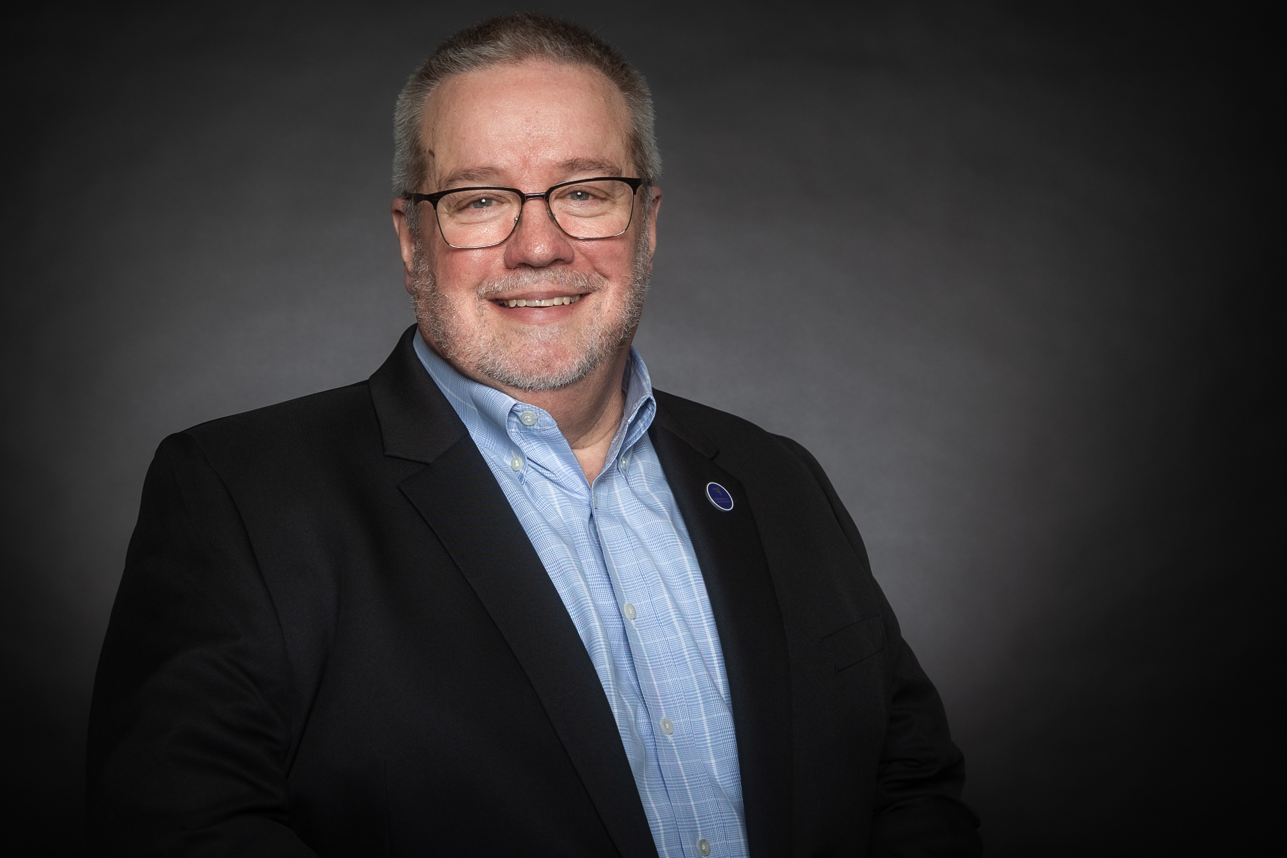 Professional headshot and action shot of Ray Riddle
