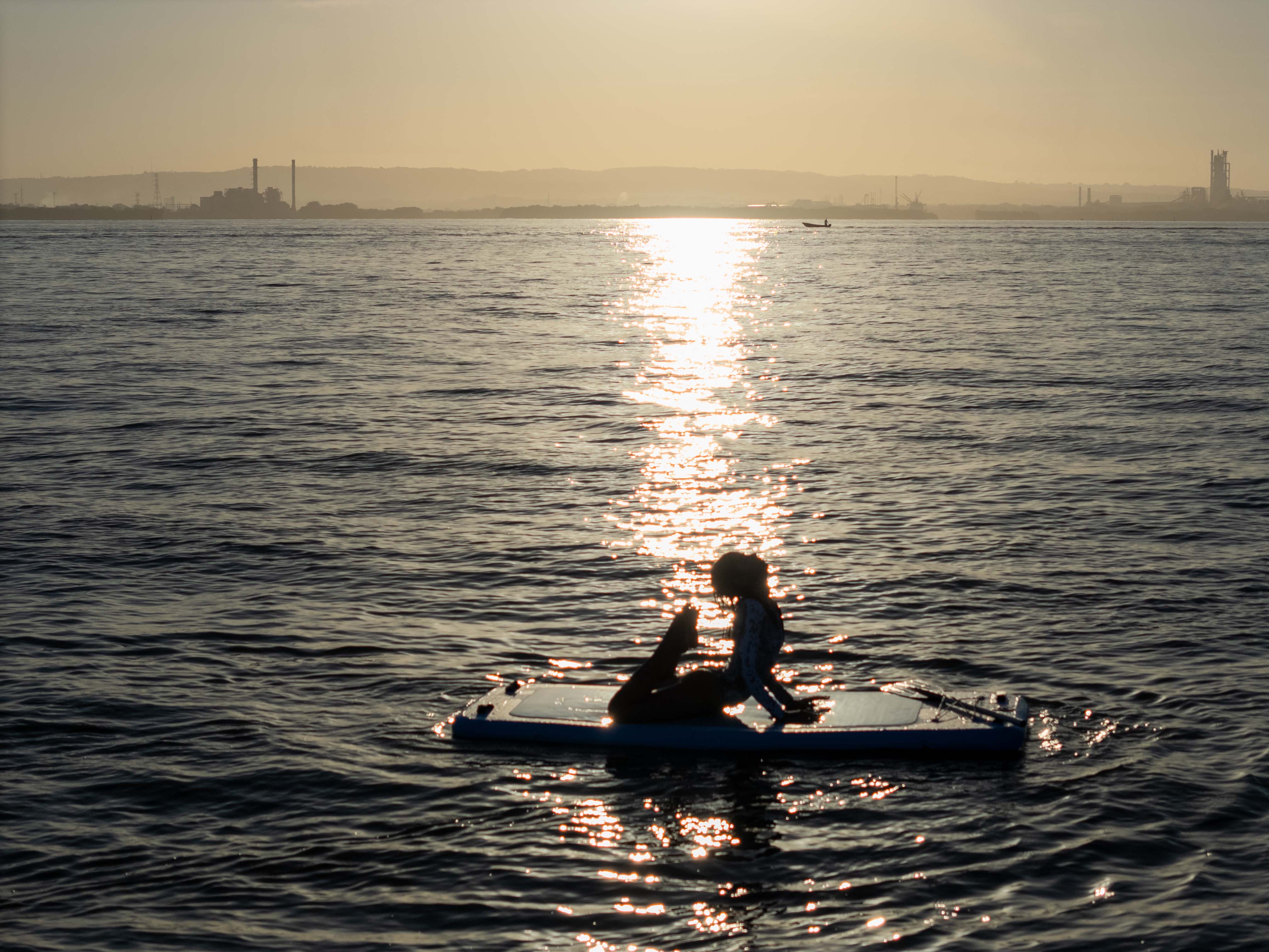 a person sitting on a paddle boat