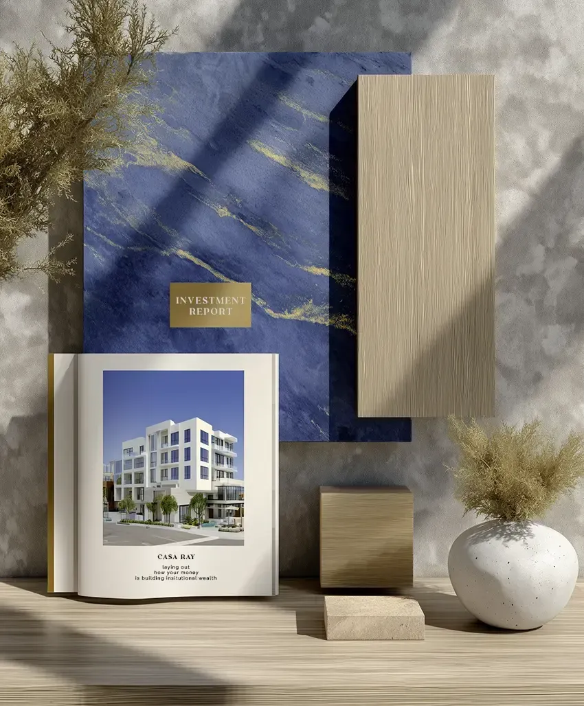 Photograph of a minimalist flat-lay, an open, beautifully designed investor report rests on a textured dark wood surface. The report demonstrates radical clarity.