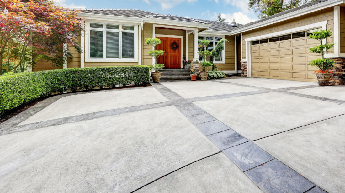 large concrete driveway with tile accents