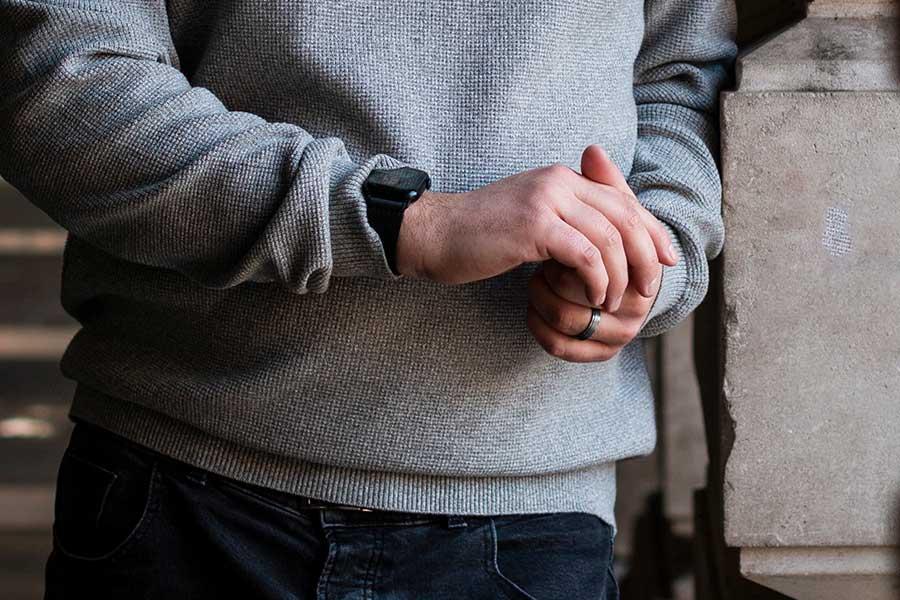 A business owner looking at their watch