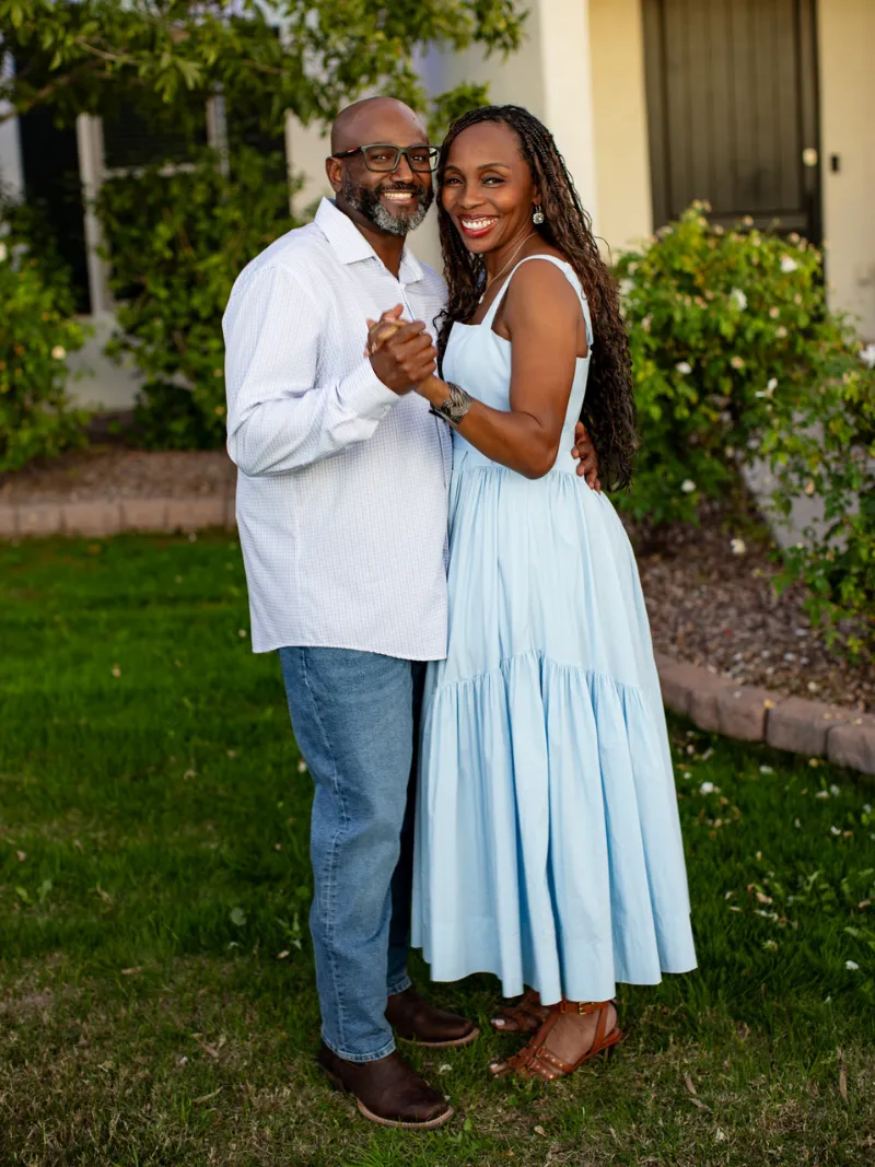 Couple dancing together in their backyard during a lifestyle portrait session in their home in Gilbert, Arizona taken by Andria May Photography.