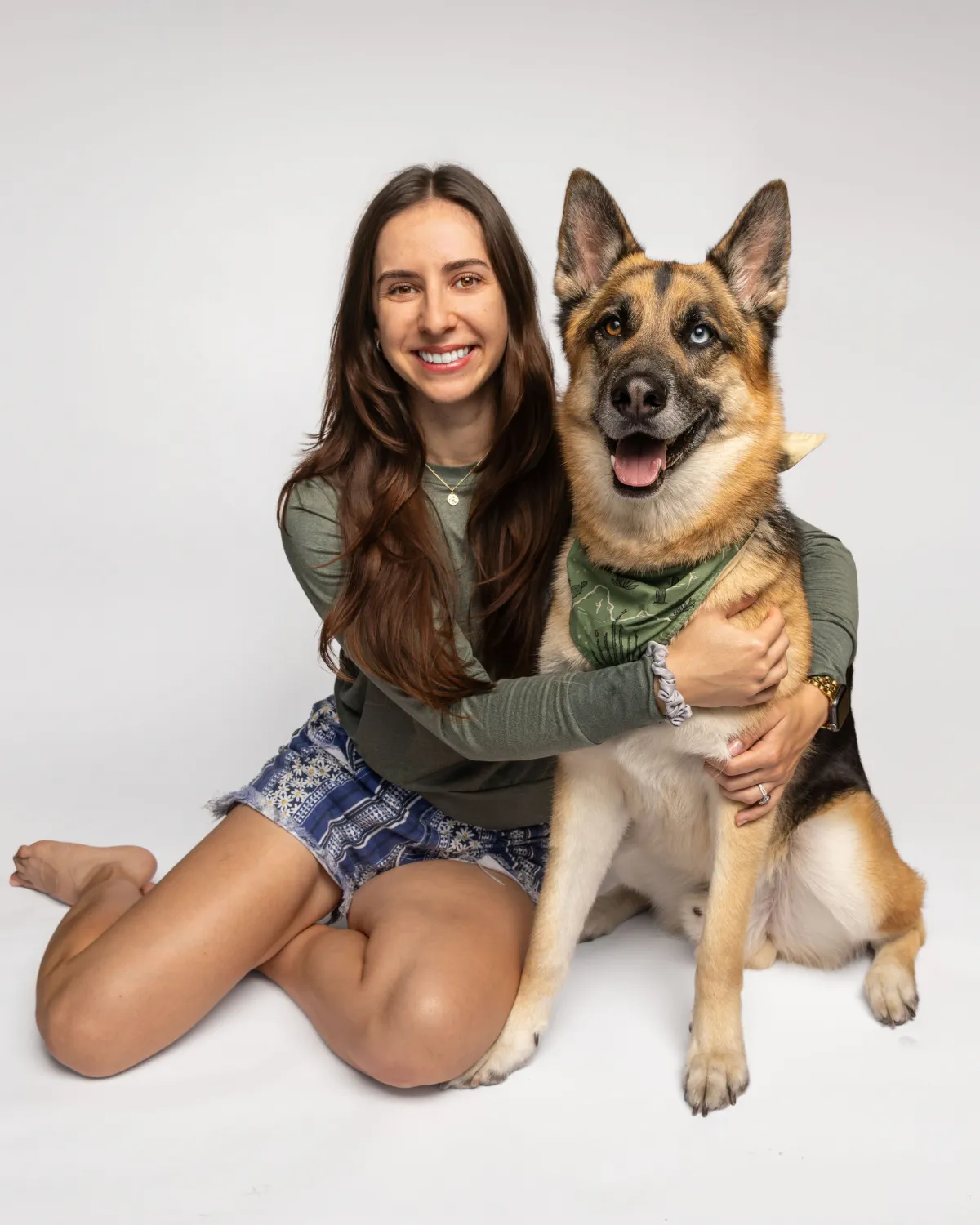 Woman hugging her German Shepherd during a portrait session with a Gilbert dog photographer