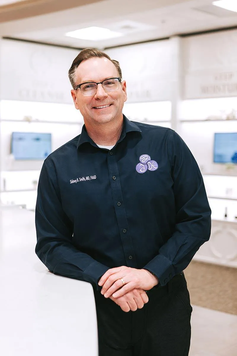 Board-Certified Dr. Sidney Smith at DermaCare consultation office